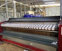 งานติดตั้งสายพานป้อนผ้าคอตตอน NICHOLINE สำหรับเครื่องรีดผ้า TOLKAR - 8