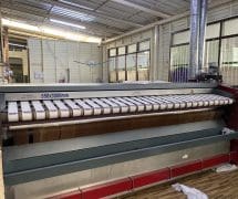 งานติดตั้งสายพานป้อนผ้าคอตตอน NICHOLINE สำหรับเครื่องรีดผ้า TOLKAR - 9