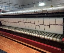 งานติดตั้งสายพานรีดผ้า NICHOLINE และเทปพันลูกกลิ้ง VERTEX สำหรับเครื่องรีดผ้า TOLKAR - 11